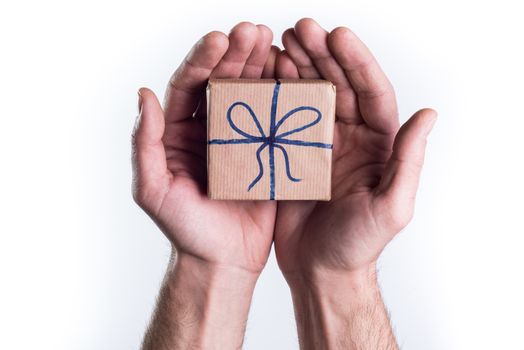 Concept hands giving gift on white background