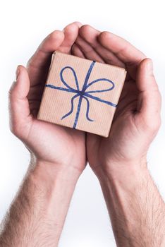 Concept hands giving gift on white background