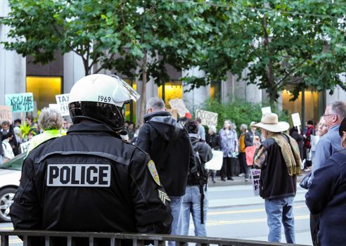 San Francisco, USA - October 7: San Francisco police looking at the protestor at Market Street on October 7, 2011 in San Francisco, USA.