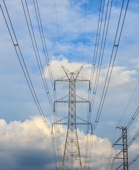 Electricity post in the evening with blue sky.