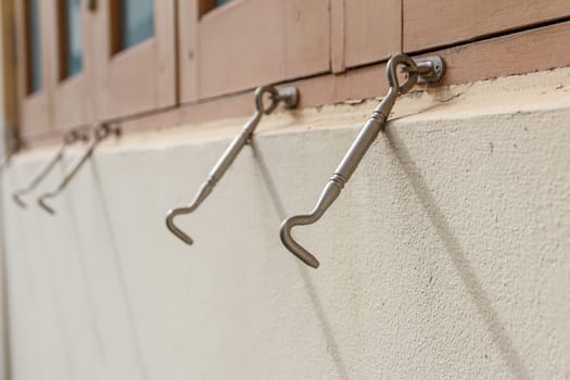 Row of hook of the windows. Focus in the front hook.