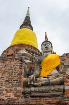 Buddha Statue at Wat Yai Chaimongkol - Ayutthaya.In front of the pagoda