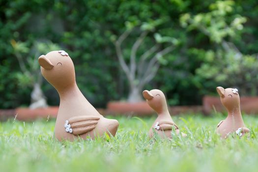 A family of clay doll duck (Mom & Baby) in the garden