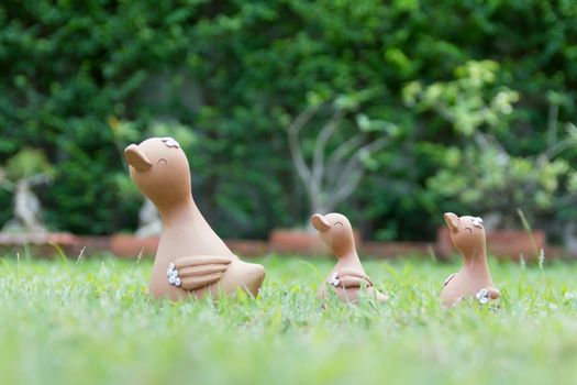 A family of clay doll duck (Mom & Baby) in the garden