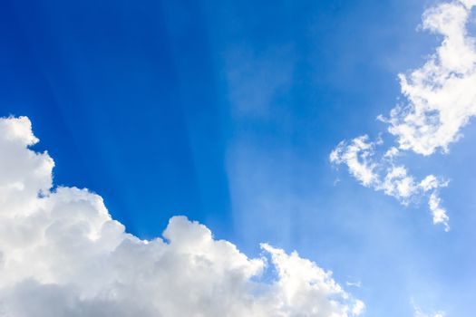 Clear sky and cloud in the sunny day with sunlight from the sun.