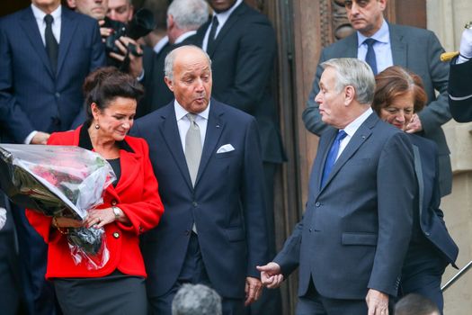FRANCE, Paris: Newly appointed French Foreign Minister Jean-Marc Ayrault (R) escorts France's outgoing Foreign Minister Laurent Fabius (2ndL) and his companion Marie-France Marchand-Baylet (1stL) following the handover ceremony at the Foreign Ministry on February 12, 2016 in Paris. French President Francois Hollande reshuffled his cabinet on February 11, 2016, naming Jean-Marc Ayrault foreign minister and adding several ecologists to government as he seeks to widen his political base ahead of a presidential poll in 2017. 