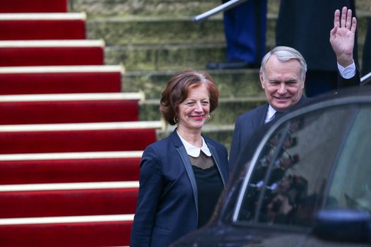 FRANCE, Paris: Newly appointed French Foreign Minister Jean-Marc Ayrault (R)  and his companion Brigitte Ayrault (L) escorts France's outgoing Foreign Minister Laurent Fabius and his companion Marie-France Marchand-Baylet  following the handover ceremony at the Foreign Ministry on February 12, 2016 in Paris. French President Francois Hollande reshuffled his cabinet on February 11, 2016, naming Jean-Marc Ayrault foreign minister and adding several ecologists to government as he seeks to widen his political base ahead of a presidential poll in 2017. 