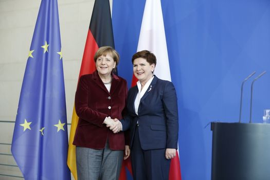 GERMANY, Berlin: German Chancellor Angela Merkel (L) and Polish Prime Minister Beata Szydlo (R) shake hands after a press conference in the Chancellery in Berlin, Germany on February 12, 2016.
