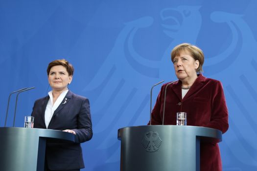 GERMANY, Berlin: German Chancellor Angela Merkel (R) talks to the press after a joint discussion with Polish Prime Minister Beata Szydlo (L) in the Chancellery in Berlin, Germany on February 12, 2016.