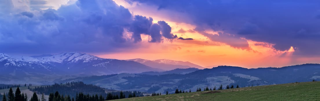 Sunny spring evening. April mountain sunset in Carpathians