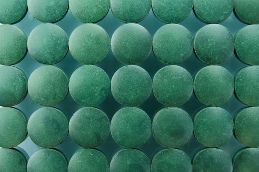 Spirulina supplements in tablet, made from blue green algae 
