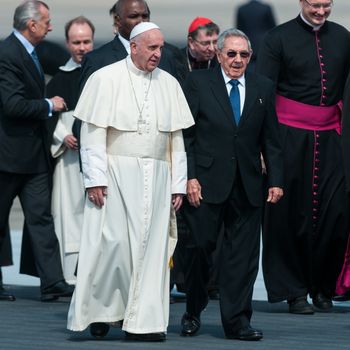 CUBA, Havana: Pope Francis walks side-by-side with Cuban President Raul Castro (right) shortly after his arrival at Jose Marti airport in Havana, Cuba on February 12, 2016. The pope's arrival would be followed immediately by a historic meeting with Russian Orthodox Patriarch Kirill.