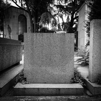 More than 100 years old statue. Cemetery located in North Italy.