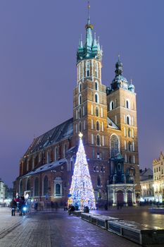 The St. Mary's basilica in Krakow, Poland at night during Christmas time.