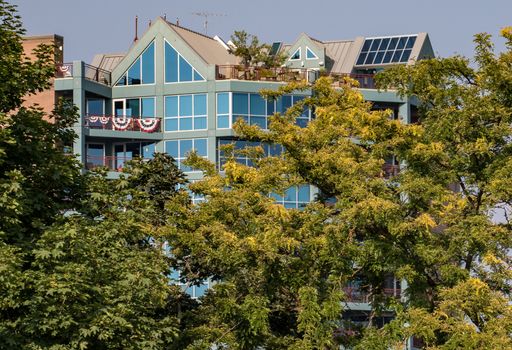 Coeur d'Alene, Idaho, USA-July 9, 2015: A view of a large apartment building and offices in Idaho from LakeCoeur d'Alene during sunset.