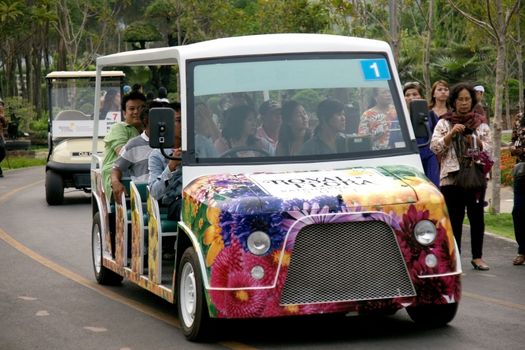 CHIANGMAI, THAILAND - MARCH 13 2012: Shuttle bus service in area of Royal Flora Ratchapruek Park.