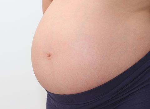 Photo of a cute pregnant woman belly