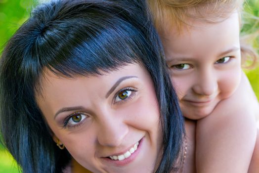 close-up portrait of a beautiful mother and daughter