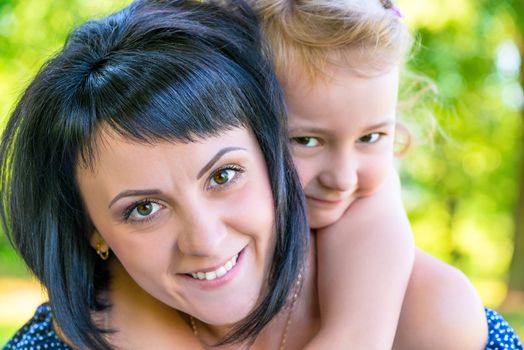 portrait of a beautiful mother and daughter close-up