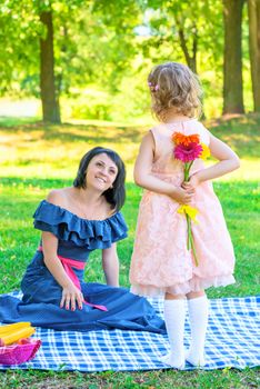 daughter holding a present on Mother's Day