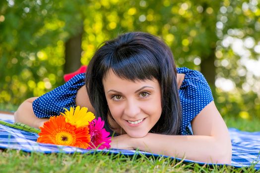 a beautiful young girl and a bouquet of flowers