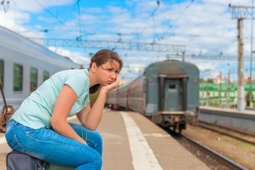 Portrait of distressed girl was late for his train