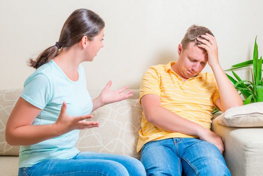 family quarrel on a couch in the living room