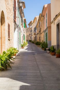 A narrow street in the medieval city of Alcudia, Majorca, Spain.