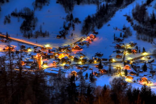 Night view of the mountain village of Vissoie, canton of Valais, Switzerland, taken from uphill at the village of St Luc.