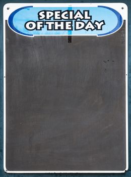 Well used Black chalkboard advertising the special of the day