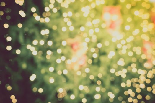 Gold Christmas background of de-focused lights with decorated tree, Christmas background 