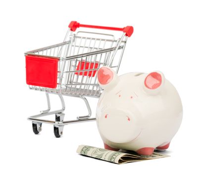 Shopping cart and Piggy bank, business concept. Conflict between savings and expenses. Isolated