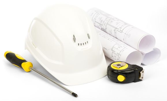 Planning of construction of house. Drawings for building house, helmet and other working tools on isolated white background