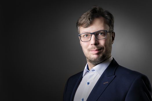 image of a friendly adult business man with glasses