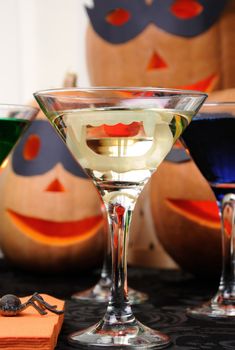 martini vampire  with jaws in a glass on the table in honor of Halloween