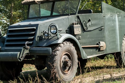 Gray and olive vintage military truck on the road