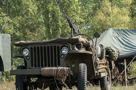 Gray and olive vintage military truck on the road