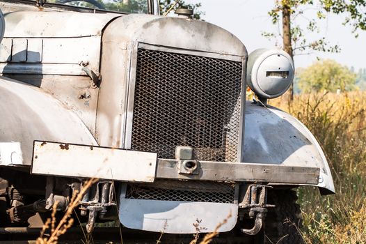 Gray and olive vintage military truck on the road