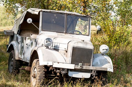 Gray and olive vintage military truck on the road