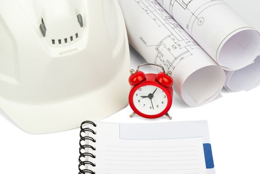 Blueprint rols and helmet with alarm clock and copybook on isolated white background