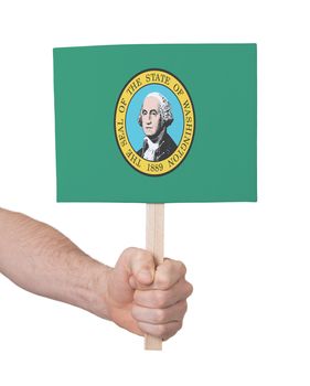 Hand holding small card, isolated on white - Flag of Washington