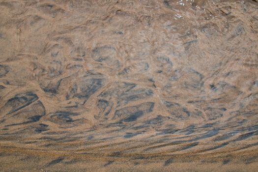 Design created by the nature. Sand creating various patterns. Atlantic ocean coast, Morocco.