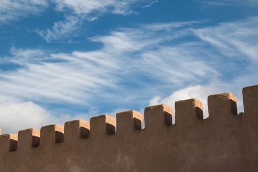 Detail of the old fortification in the late afternoon light. Cloudy sky in the background.