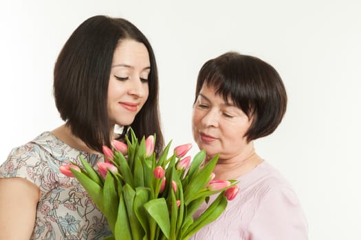 the woman presented a bouquet of flowers for mother