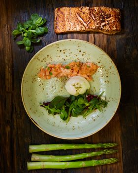 Poached eggs with salmon and asparagus. Top of view