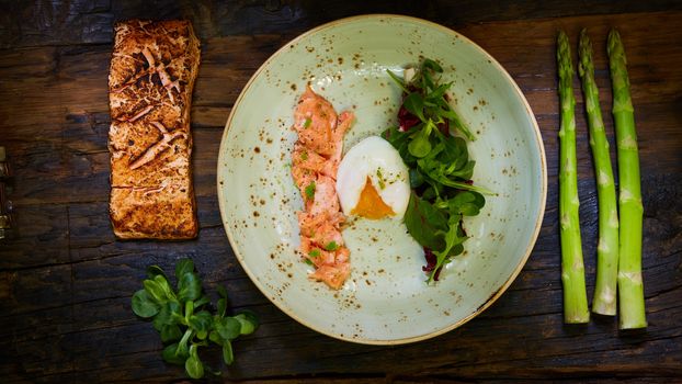 Poached eggs with salmon and asparagus. Top of view