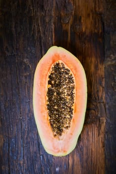 top view sliced fresh papaya on old wooden table