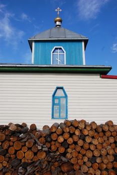 Woodpile at christian church building, Pevek town, Chukotka, Russia