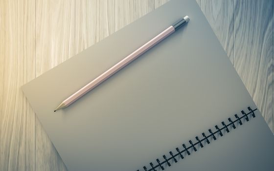 pencil on checked notebook on wood background, stationary object