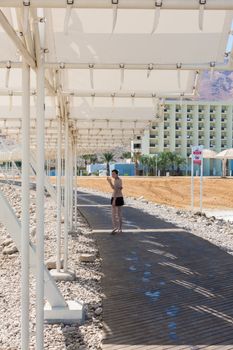 Woman resting on the beach Dead Sea